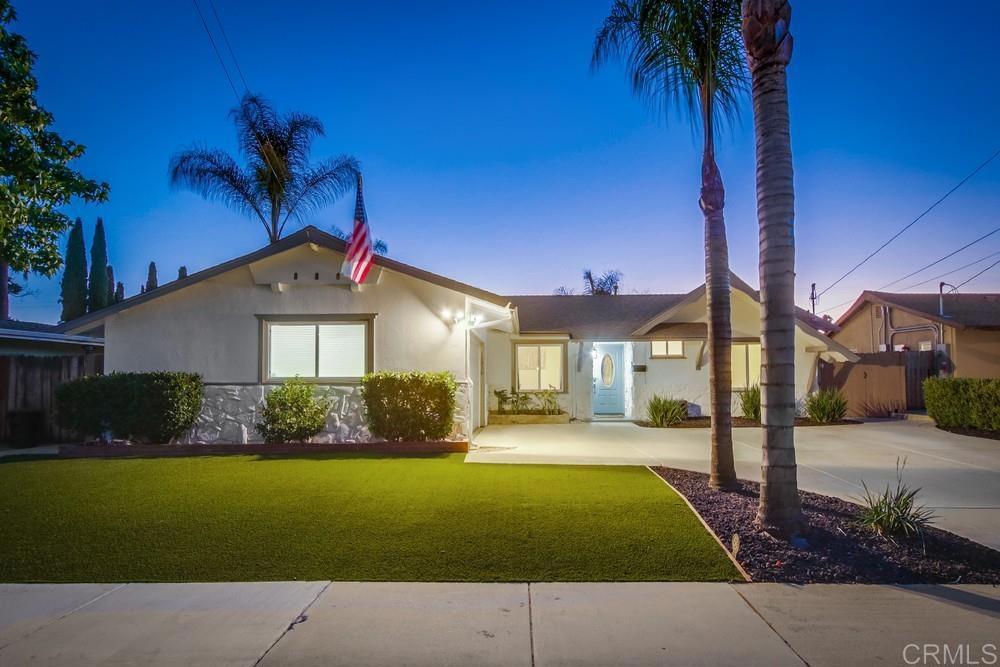 12930 Morene Street Poway, CA 92064 - Photo 2 of 26 a front view of a house with a yard
