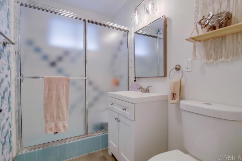 12930 Morene Street Poway, CA 92064 - Photo 21 of 26 a bathroom with a sink a toilet and shower