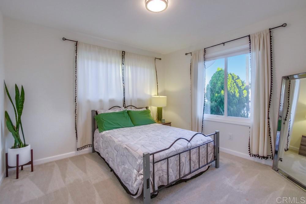 12930 Morene Street Poway, CA 92064 - Photo 22 of 26 a bed sitting in a bedroom next to a window