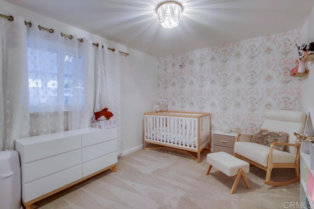 12930 Morene Street Poway, CA 92064 - Photo 24 of 26 a bathroom with a sink and a mirror