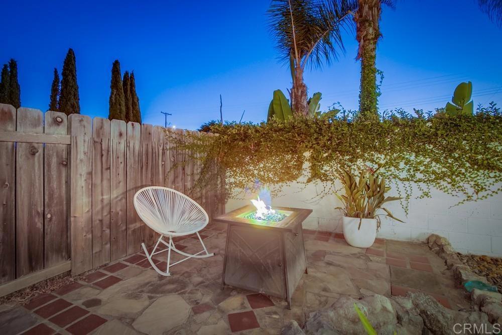 12930 Morene Street Poway, CA 92064 - Photo 10 of 26 a backyard of a house with table and chairs
