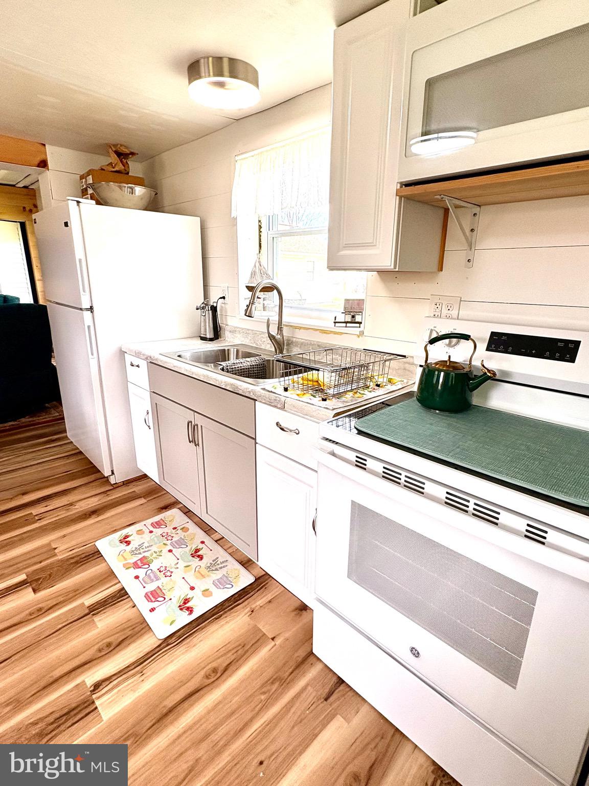 3069 Union Church Road Tylerton, MD 21866 - Photo 11 of 23 New Cabinets, Stove, Sink, Refrigerator
