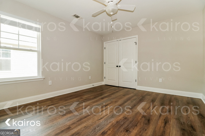 153 Cottage Grove Road Brunswick, GA 31525 - Photo 13 of 16 a view of an empty room with a window