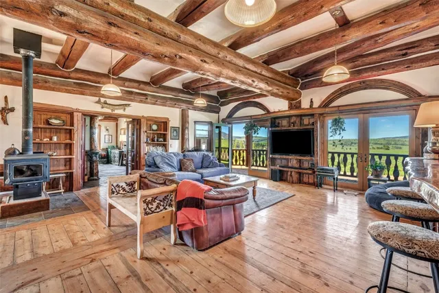 a outdoor space with lots of furniture and flat screen tv