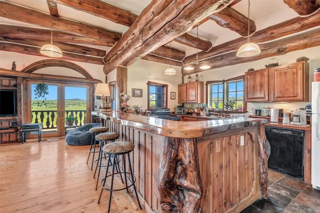 a kitchen with stainless steel appliances granite countertop a stove and a sink