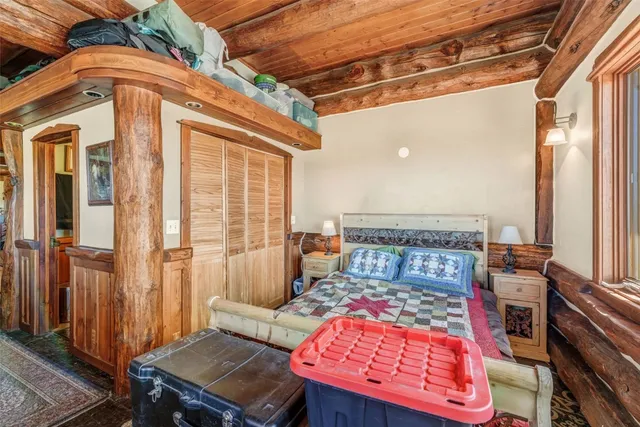 a bathroom with a granite countertop toilet sink and mirror