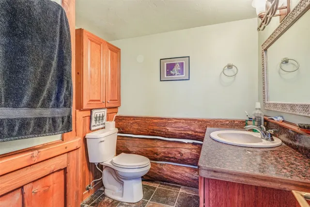 a view of a room with wooden floor and chair