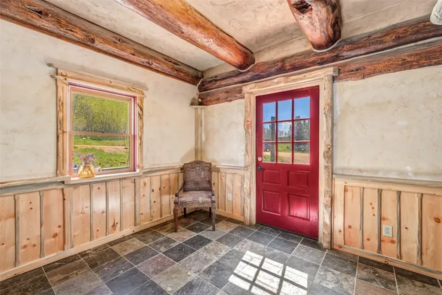 a bedroom with furniture and a window