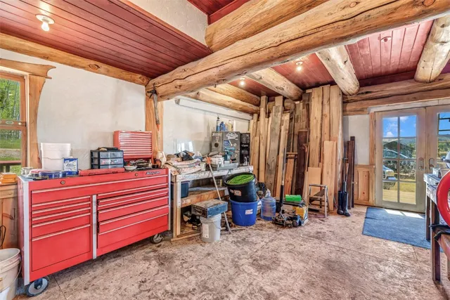 a room with lots of furniture and a chandelier
