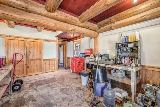 a view of a porch with a table and chairs