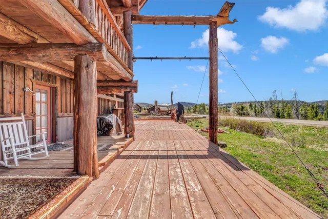a view of a house with a yard from a balcony