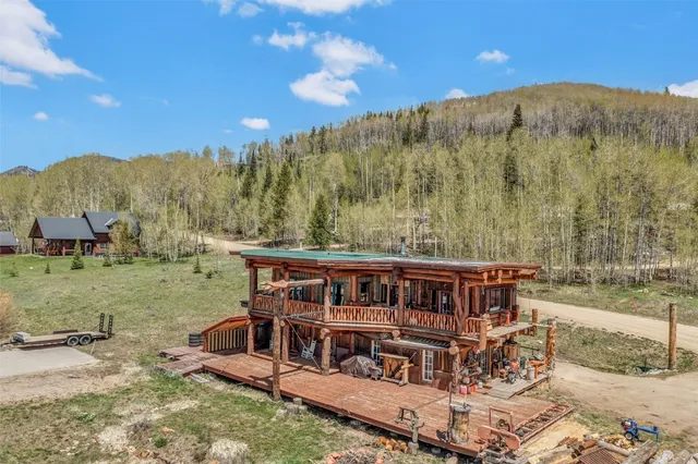 a view of a big yard with table and chairs