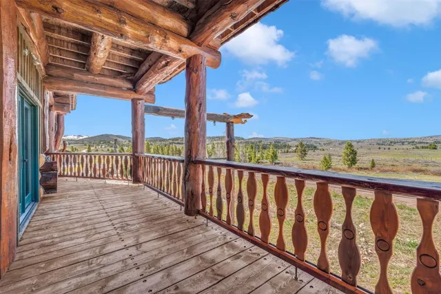 a view of a balcony with wooden floor