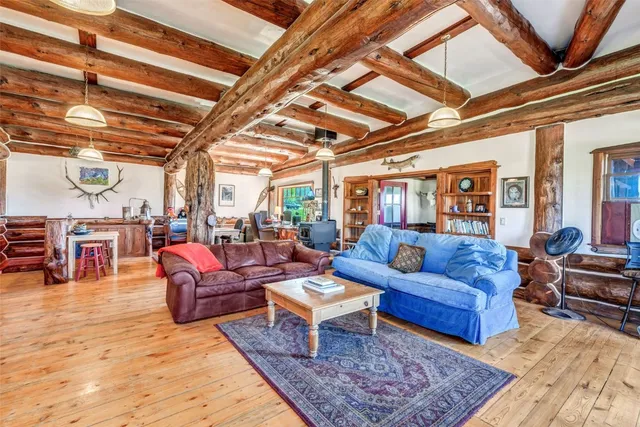 a living room with lots of furniture and a rug