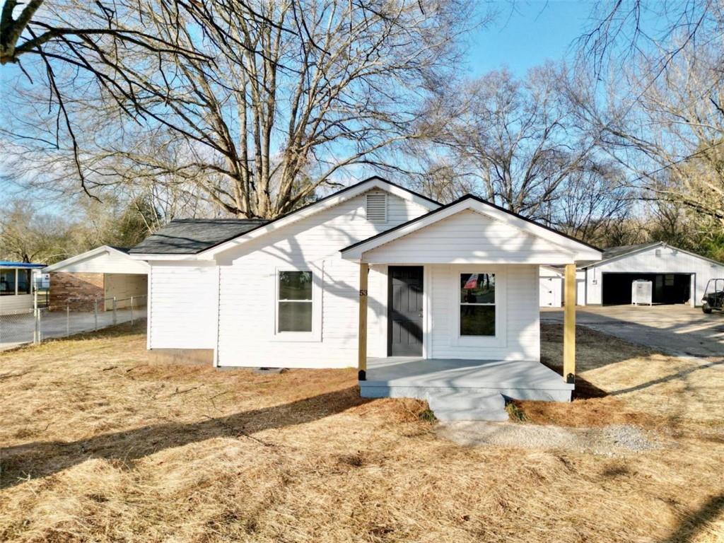 53 Barron Road Northeast Rome, GA 30161 - Photo 1 of 1 a front view of a house with a yard and garage