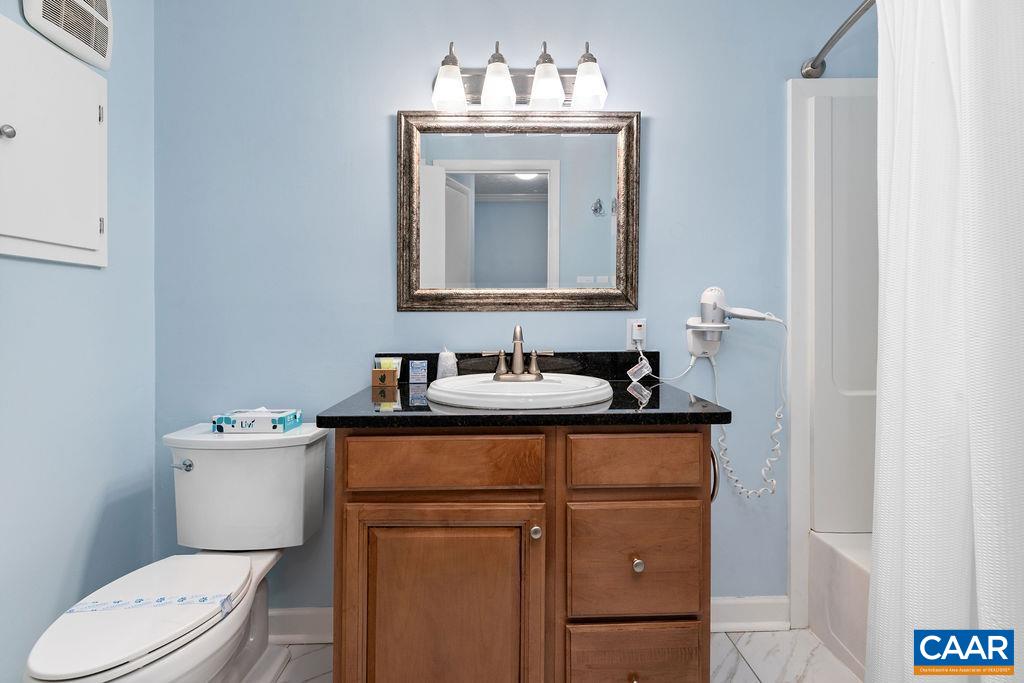216 Timbers Roseland, VA 22967 - Photo 11 of 16 a bathroom with a sink vanity mirror and toilet