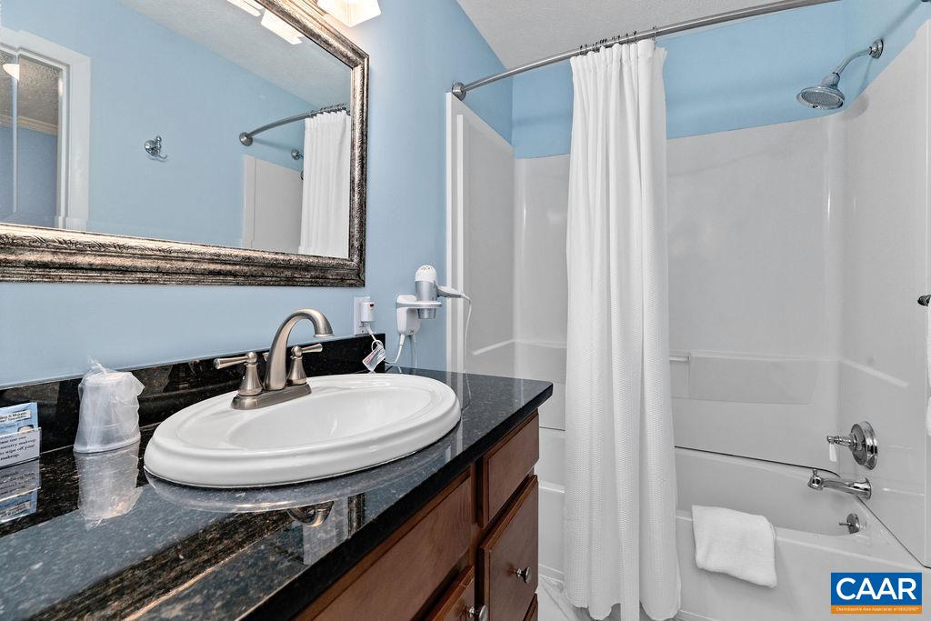 216 Timbers Roseland, VA 22967 - Photo 12 of 16 a bathroom with a sink and a mirror