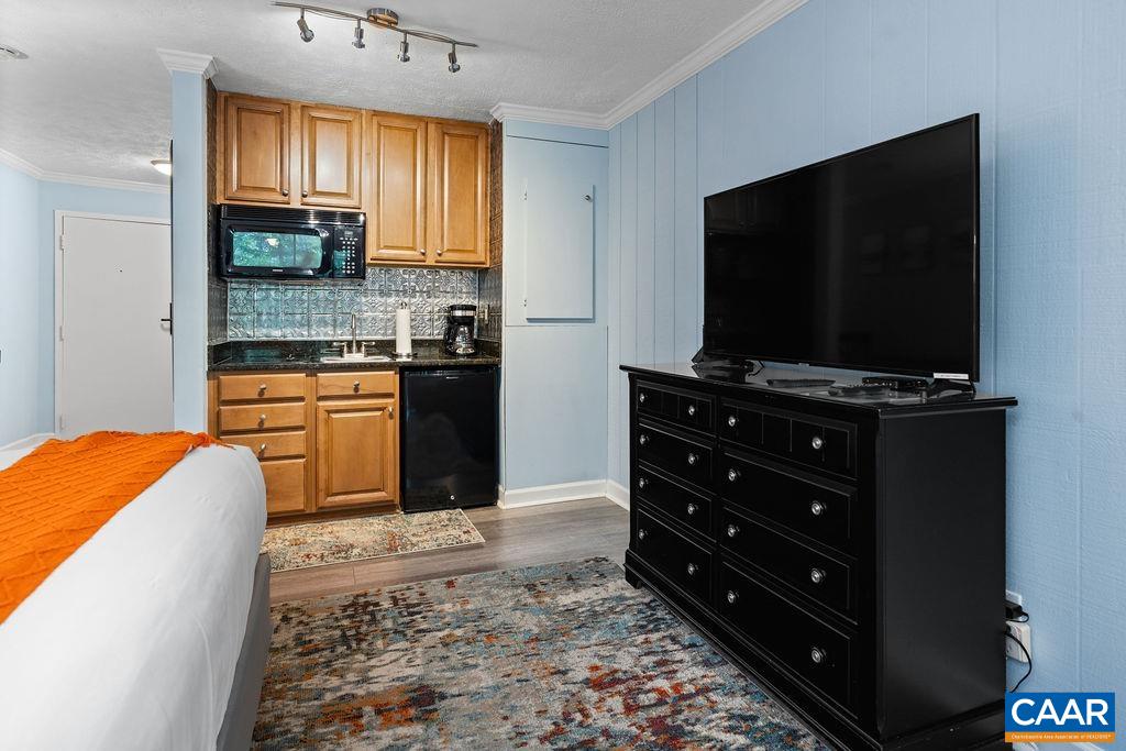 216 Timbers Roseland, VA 22967 - Photo 6 of 16 a kitchen with stainless steel appliances kitchen island granite countertop a stove a sink and a microwave