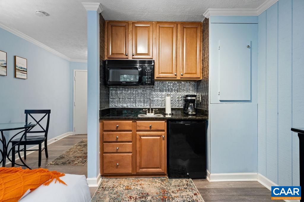 216 Timbers Roseland, VA 22967 - Photo 7 of 16 a kitchen with stainless steel appliances granite countertop a stove a sink and a refrigerator