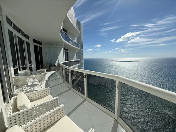 a view of balcony with furniture