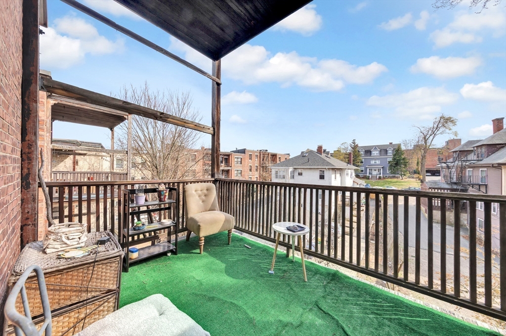 106 Strathmore Road Boston, MA 02135 - Photo 26 of 30 a view of a porch with a yard
