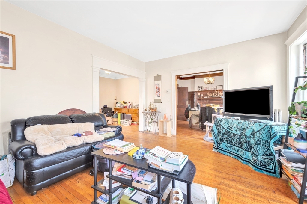 106 Strathmore Road Boston, MA 02135 - Photo 10 of 30 a living room with furniture and a flat screen tv