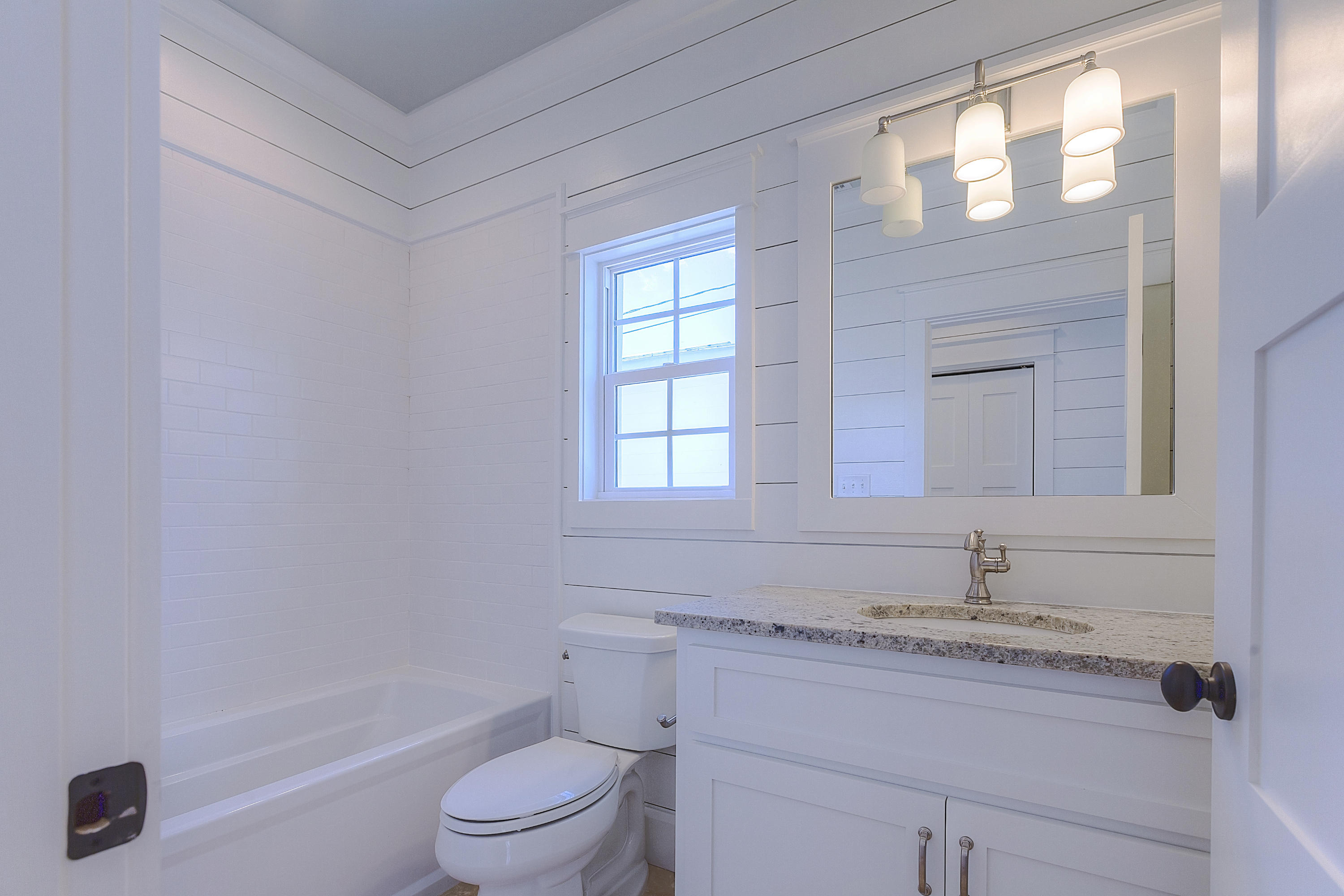 94 Emerald Cove Inlet Beach Inlet Beach, FL 32461 - Photo 2 of 21 a bathroom with a granite countertop sink a toilet and shower