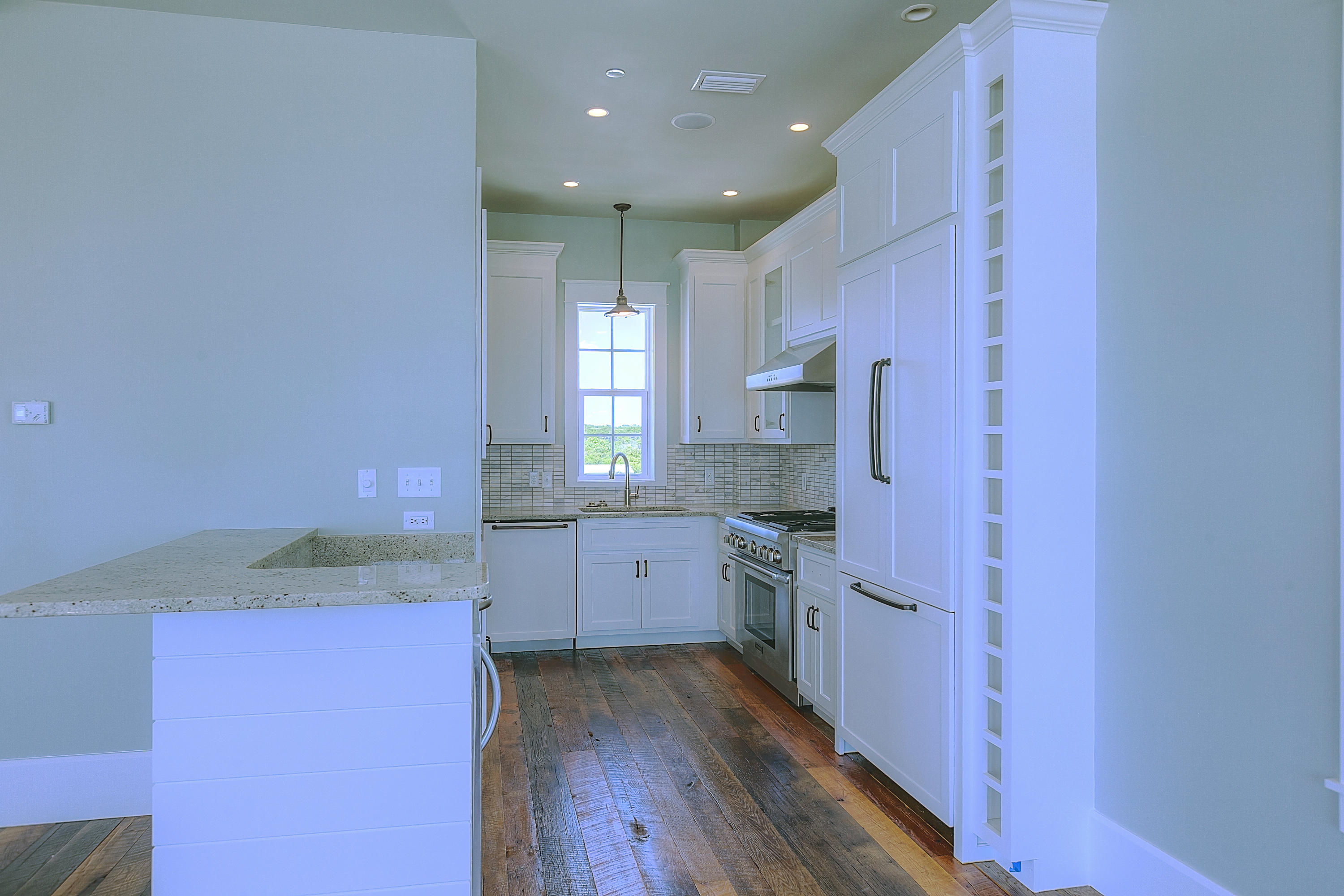 94 Emerald Cove Inlet Beach Inlet Beach, FL 32461 - Photo 14 of 21 a kitchen with granite countertop a sink stove and refrigerator