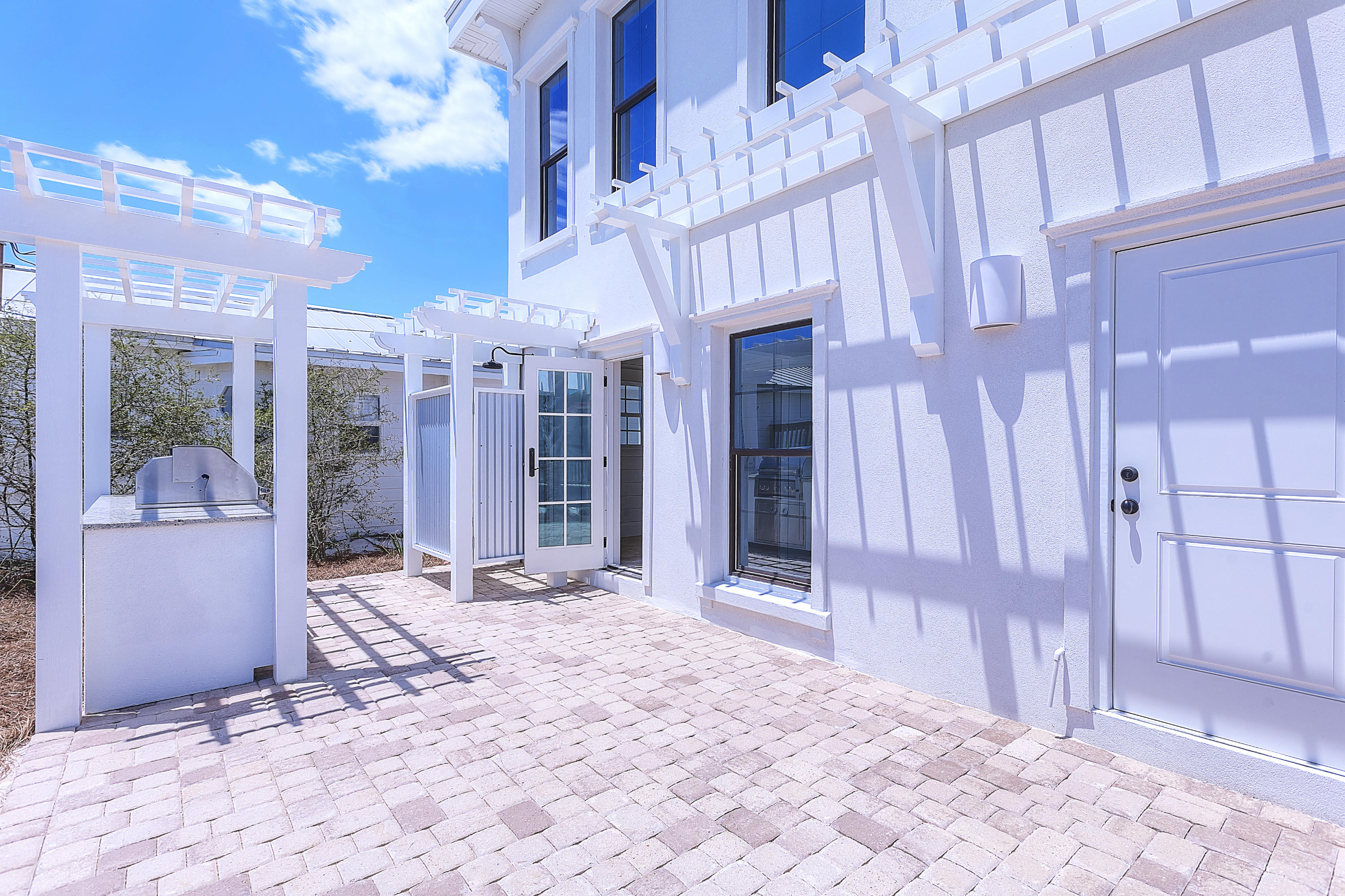 94 Emerald Cove Inlet Beach Inlet Beach, FL 32461 - Photo 5 of 21 a view of a building with a patio