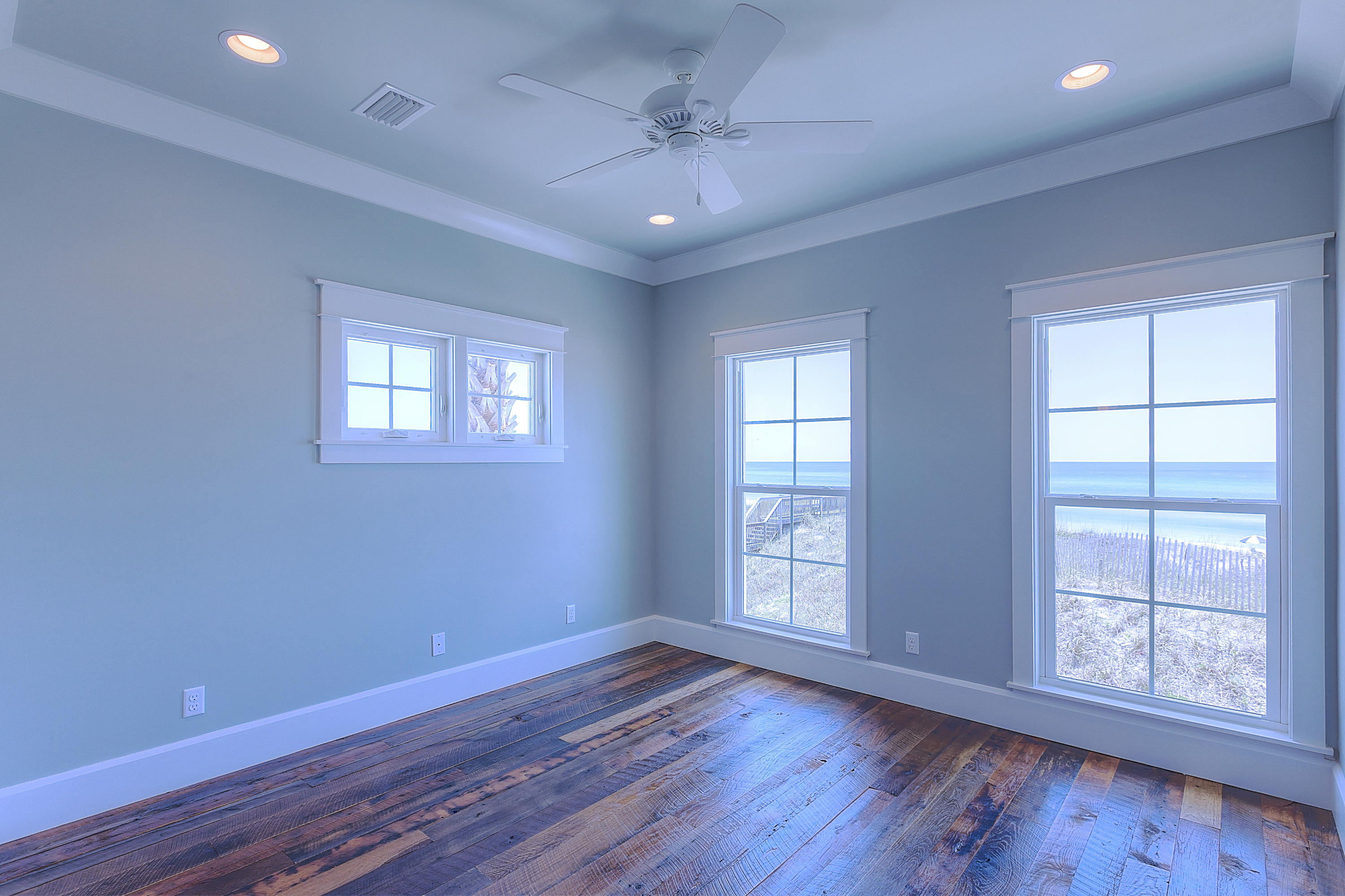 94 Emerald Cove Inlet Beach Inlet Beach, FL 32461 - Photo 6 of 21 a view of an empty room with wooden floor and a window