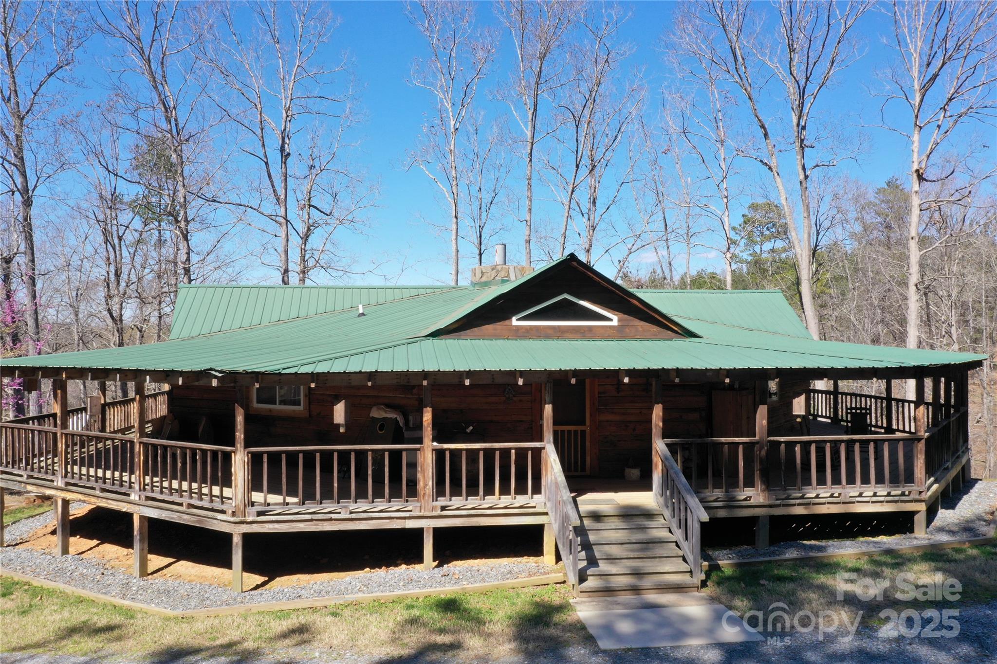 a view of house with a roof deck