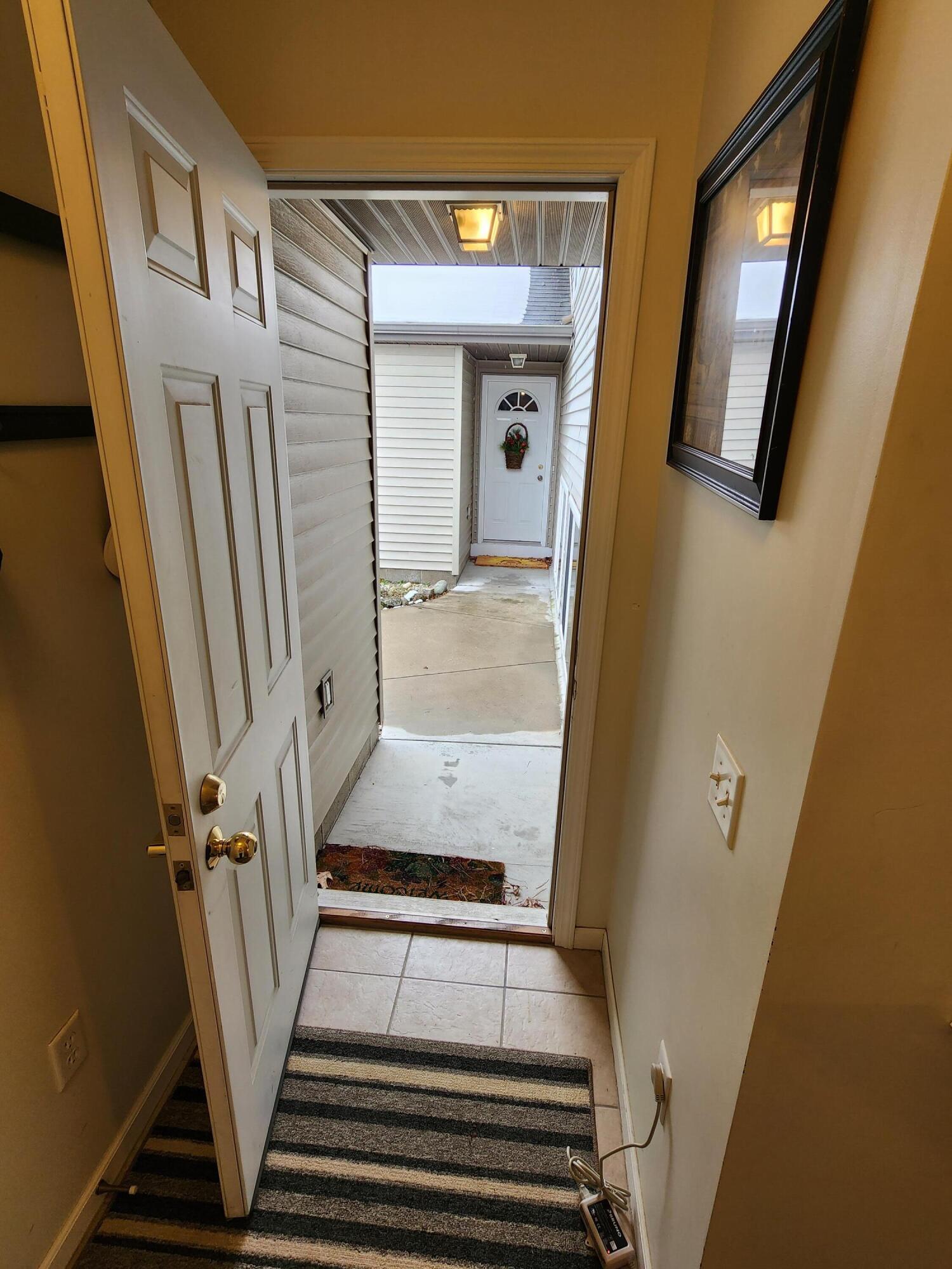 1295 North Whitehall Road, Unit 23 Muskegon, MI 49445 - Photo 30 of 35 Looking Out Front Door