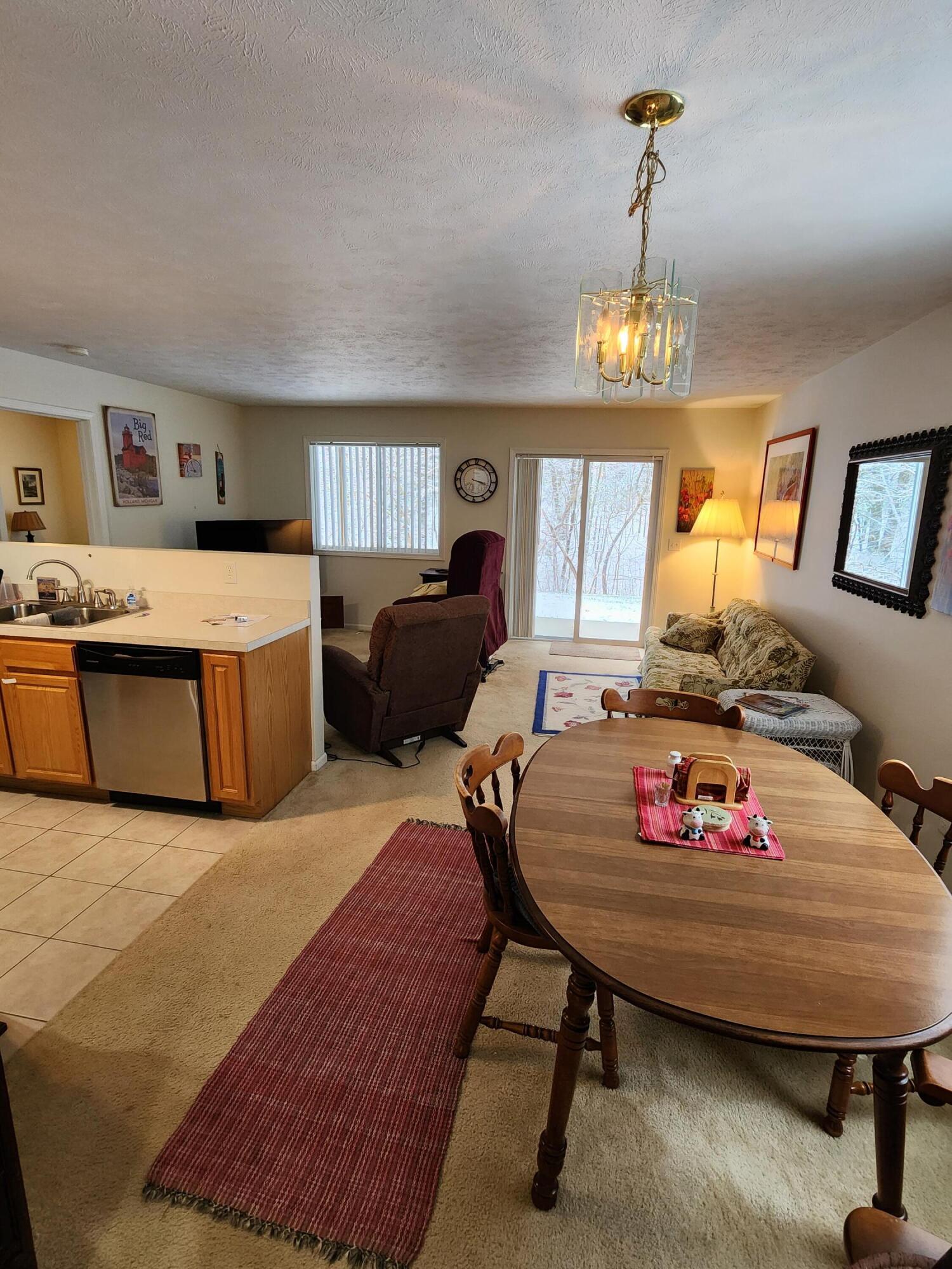 1295 North Whitehall Road, Unit 23 Muskegon, MI 49445 - Photo 6 of 35 Dining, Kitchen and Living Area