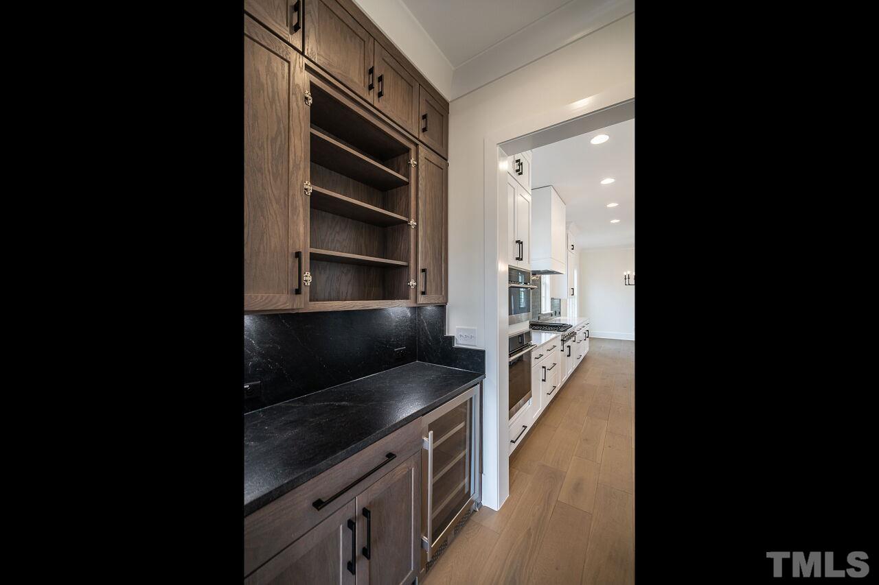 1100 Shelley Road Raleigh, NC 27609 - Photo 8 of 41 a kitchen with a stove and a refrigerator