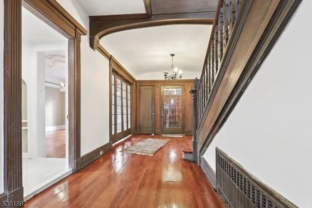 a view of an entryway with wooden floor