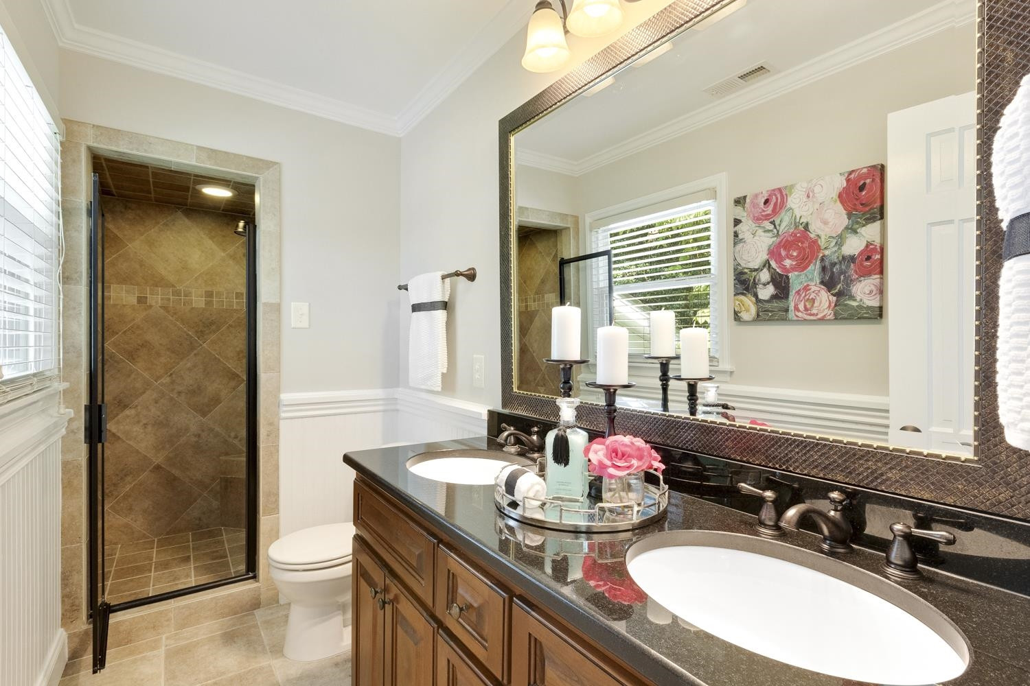 708 Dartmouth Road Raleigh, NC 27609 - Photo 9 of 15 Bright and spacious owners' bath has a beautiful walk-in tile shower, file flooring and a dual vanity. Owners Bath
