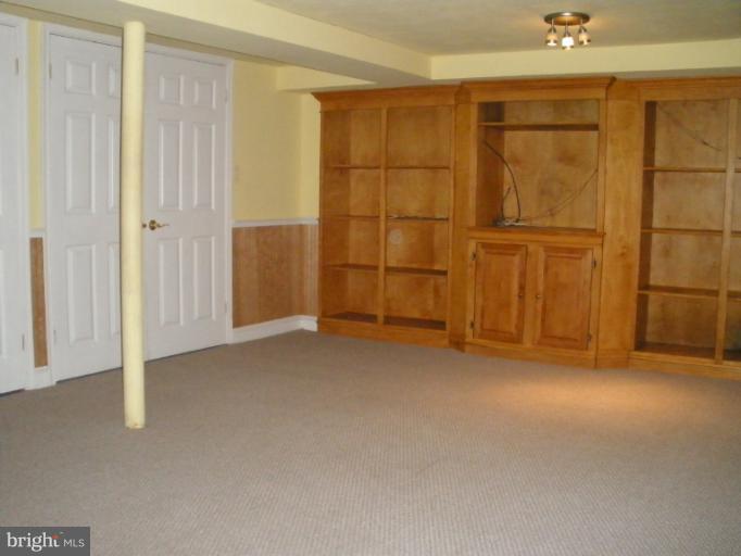 321 Dunkirk Road Baltimore, MD 21212 - Photo 2 of 30 a view of an empty room with wooden walls