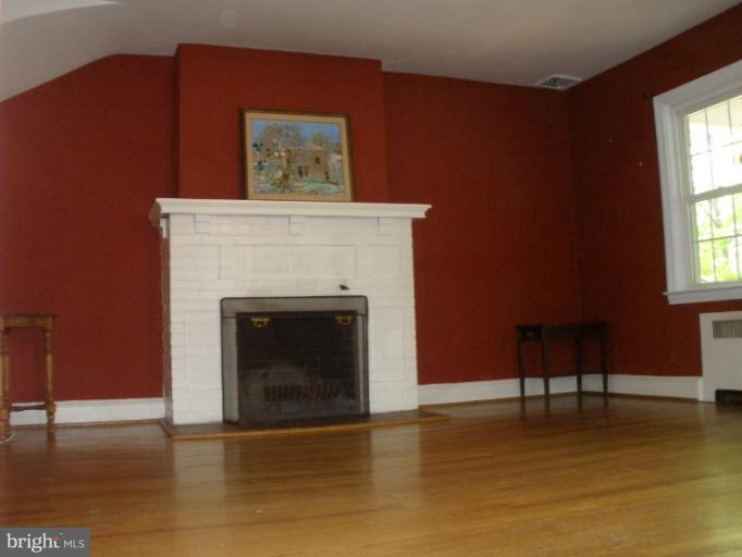 321 Dunkirk Road Baltimore, MD 21212 - Photo 12 of 30 a living room with a furniture and a fireplace