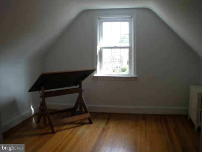 321 Dunkirk Road Baltimore, MD 21212 - Photo 21 of 30 a room with a window and wooden floor