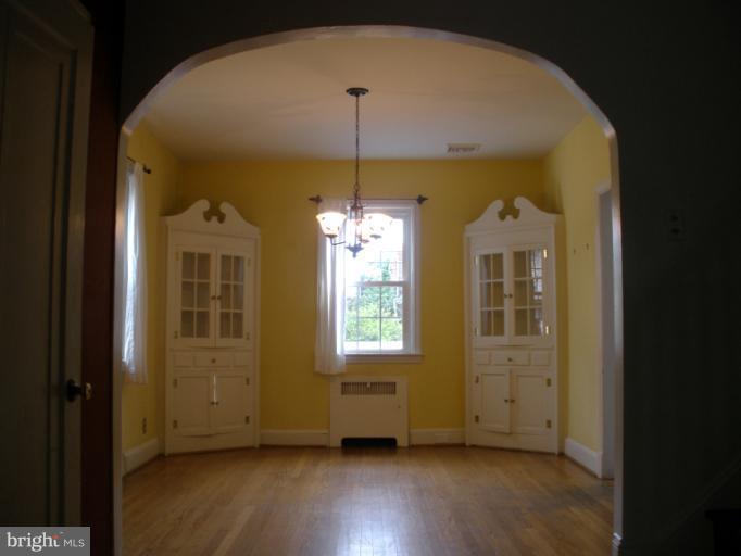 321 Dunkirk Road Baltimore, MD 21212 - Photo 23 of 30 a view of empty room with wooden floor and fan