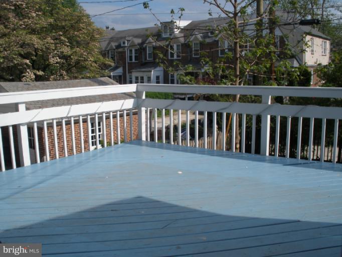 321 Dunkirk Road Baltimore, MD 21212 - Photo 5 of 30 a balcony with wooden floor and city view