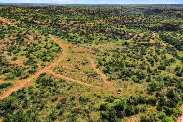 an aerial view of residential house with parking space