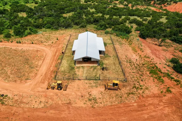 a view of swimming pool with seating area and barbeque oven