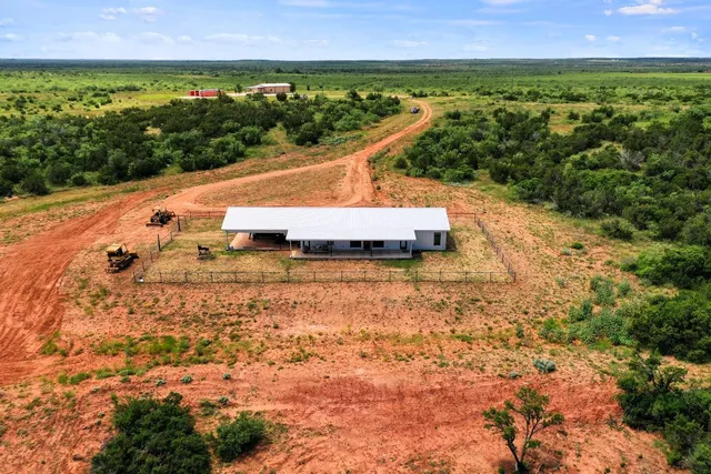 a view of a street with a yard