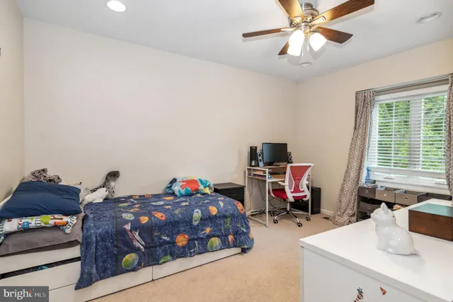 a bedroom with bed and a window