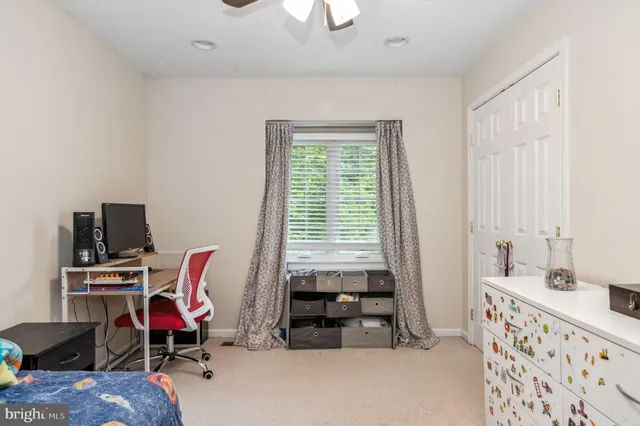 a bedroom with furniture and a window