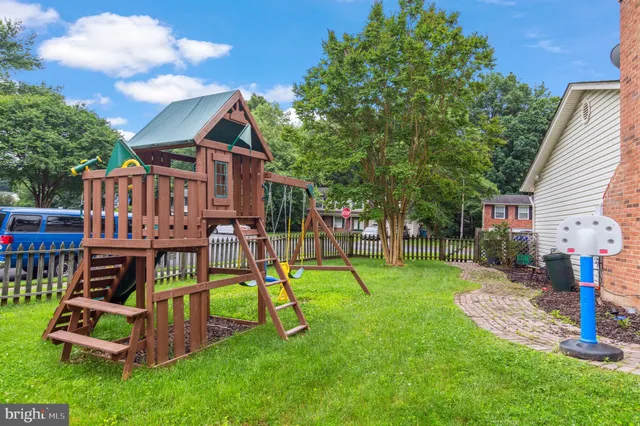 a view of a backyard with a table and chairs