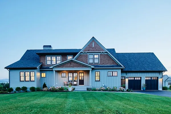 a front view of a house with a yard