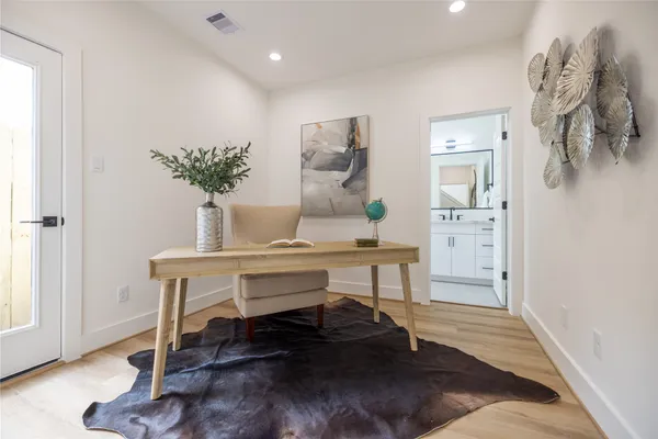 a view of a room with a table and chairs in a room