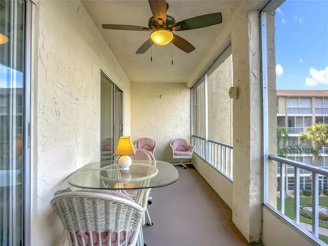 a balcony view with a seating space
